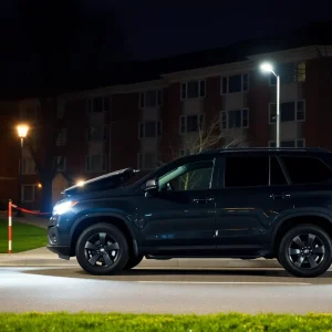 Suspicious dark SUV near university campus at night