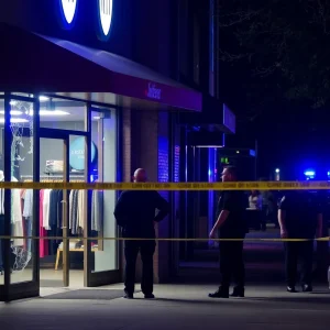 Scene at Buffalo Exchange showing a broken window after a burglary incident